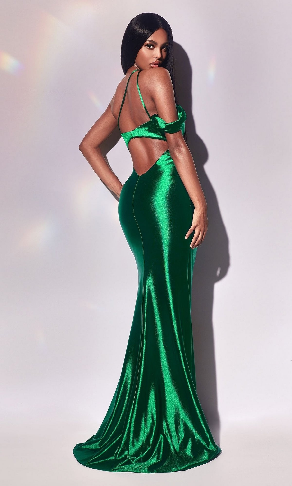 A woman poses in the One-Shoulder Cut-Out Long Formal Dress Y025, featuring a long, elegant silhouette with cut-out details, against a plain light background.